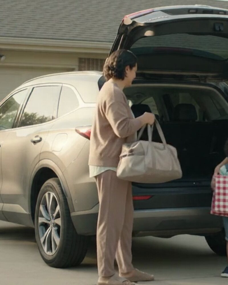 A family loading an everyday vehicle for a weekend drive